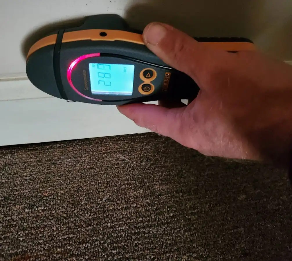 Moisture detection at baseboard during Storm Damage Restoration in South Berwick